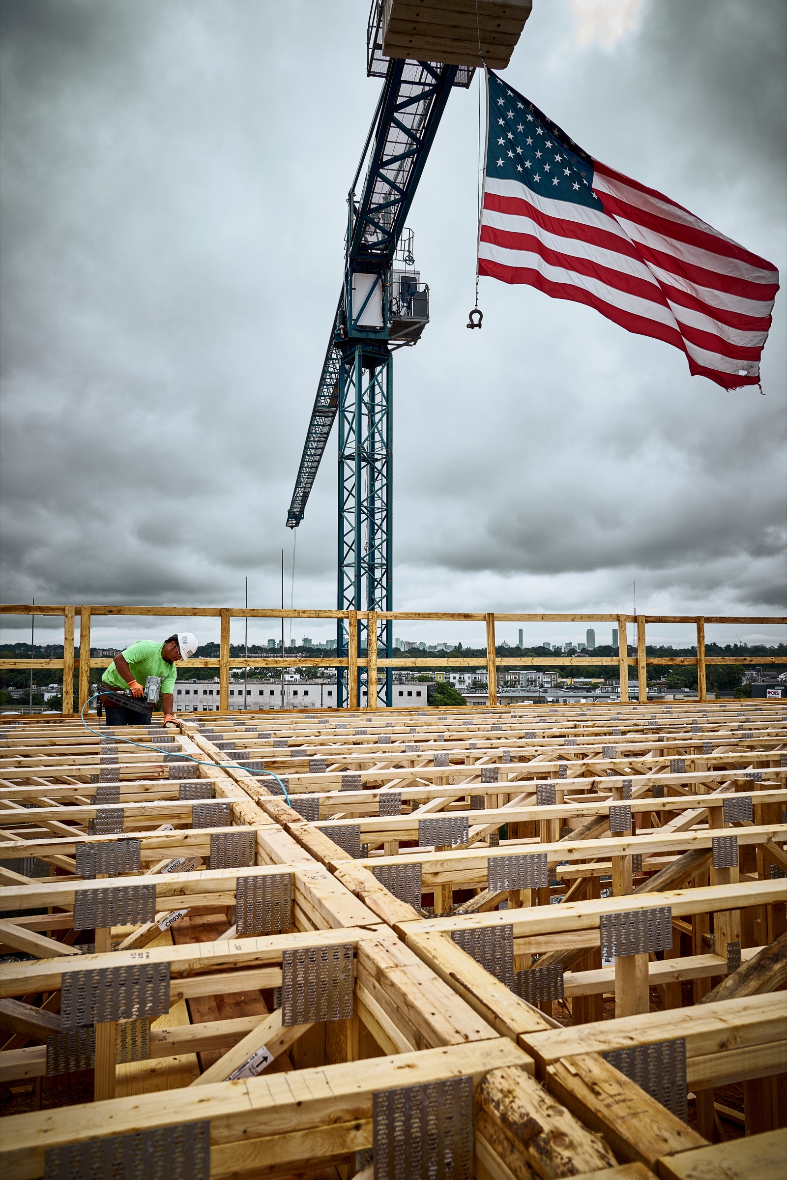 Tower crane with American flag at 55 Wheeler Street, Cambridge MA — construction photography by Bruce Peter Morin