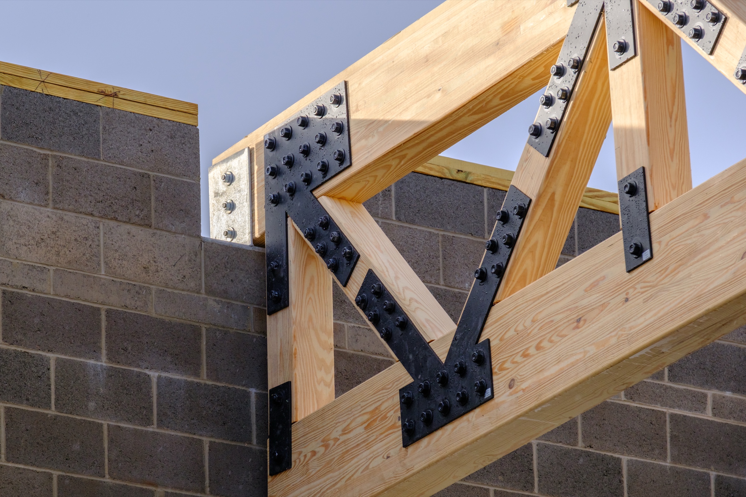 Timber truss installed with steel plate connectors, Cranston Rhode Island — construction photography by Bruce Peter Morin