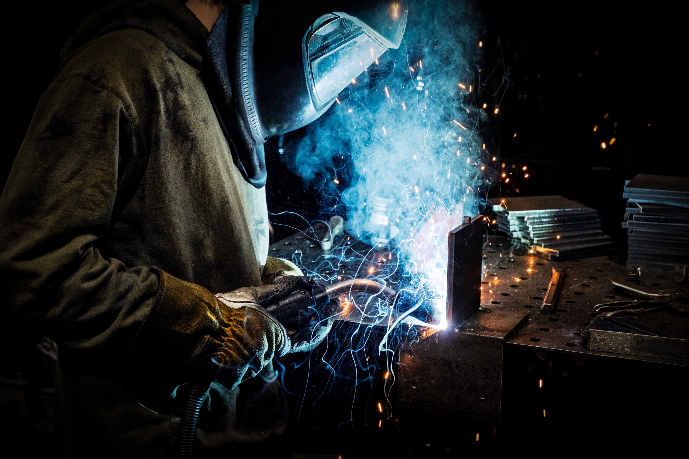 Welder at Endurable Building Products, Brooklyn Center Minnesota — construction photography by Bruce Peter Morin